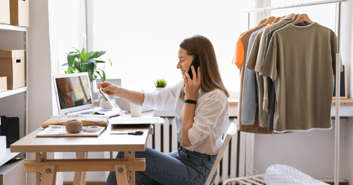 Business Woman sitting while talking on the phone