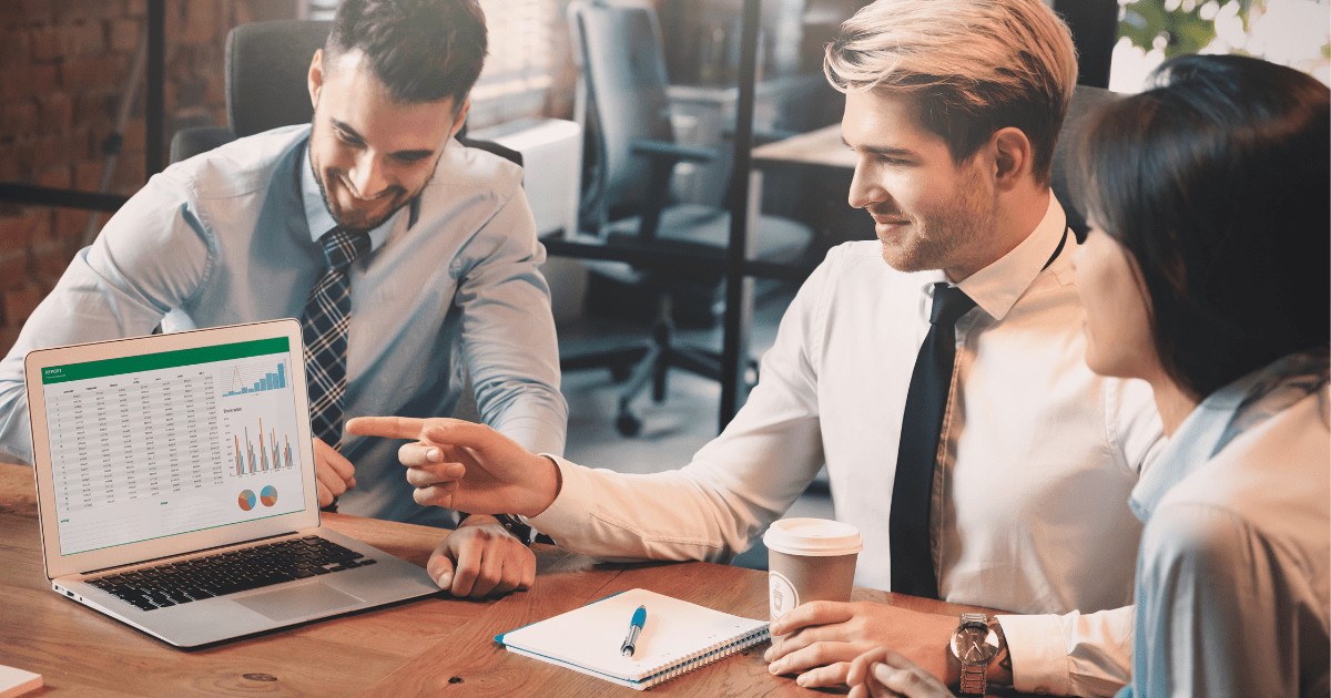 two men and one female employee discussing about quickbooks and netsuite software